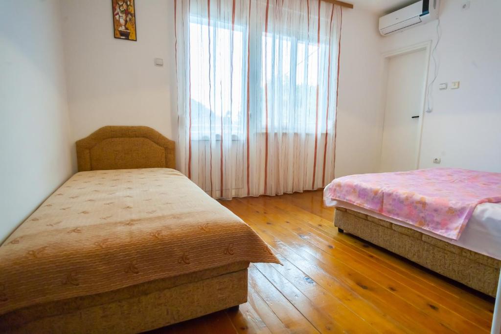 Postel nebo postele na pokoji v ubytování Rooms Molabeciri