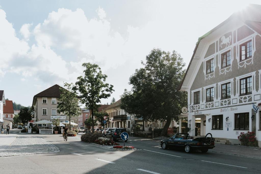 an old car parked on a street in a town at HEIMATEL - Ferienhaus Prinz-Lui in Scheidegg