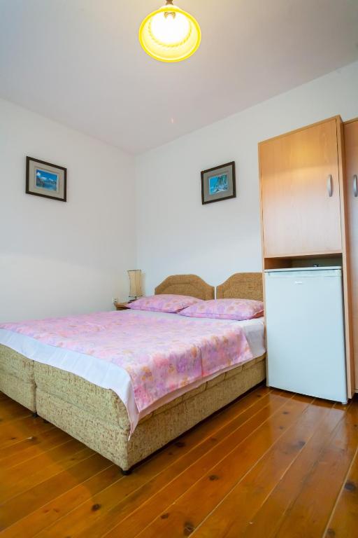 Postel nebo postele na pokoji v ubytování Rooms Molabeciri