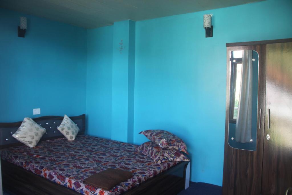 Postel nebo postele na pokoji v ubytování Mukhia's HomeStay Amayras