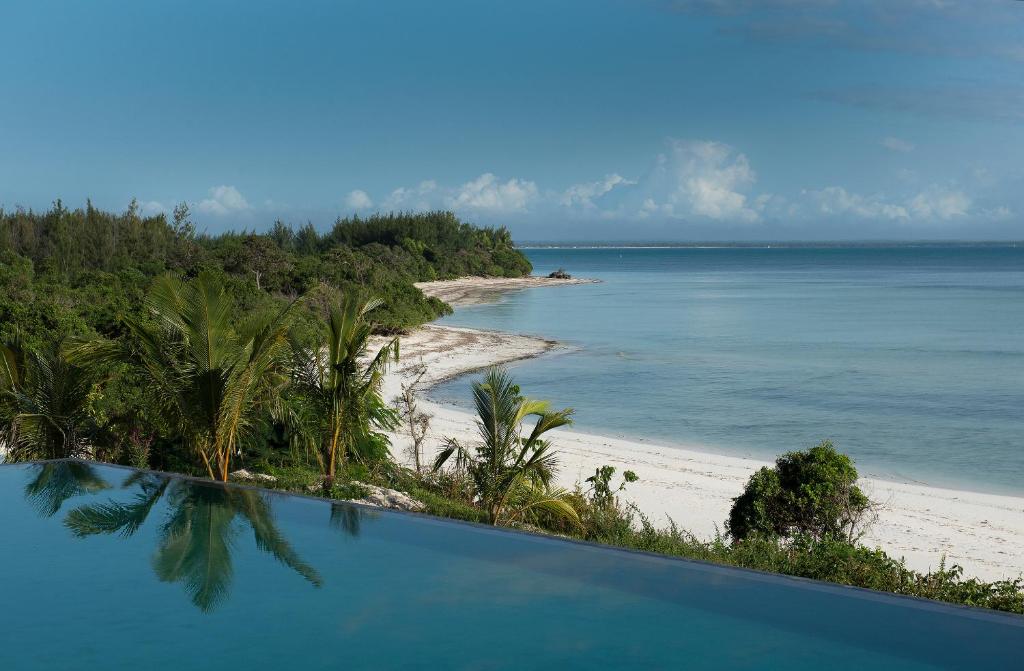 a view of a beach from a swimming pool at Qambani Luxury Resort in Michamvi