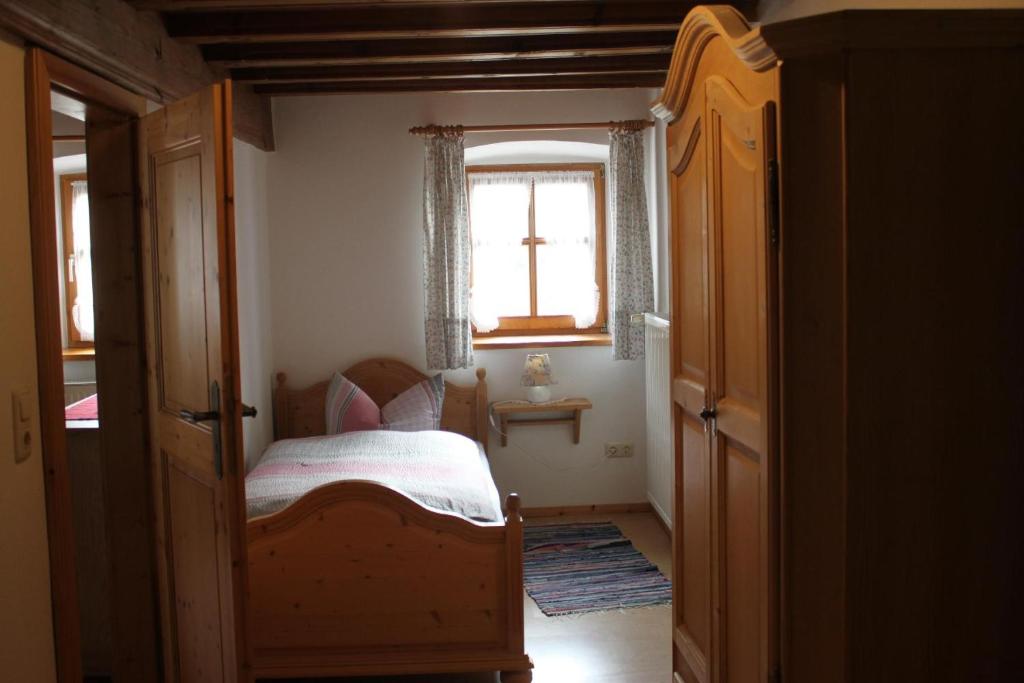 Postel nebo postele na pokoji v ubytování Ferienhof Aiginger