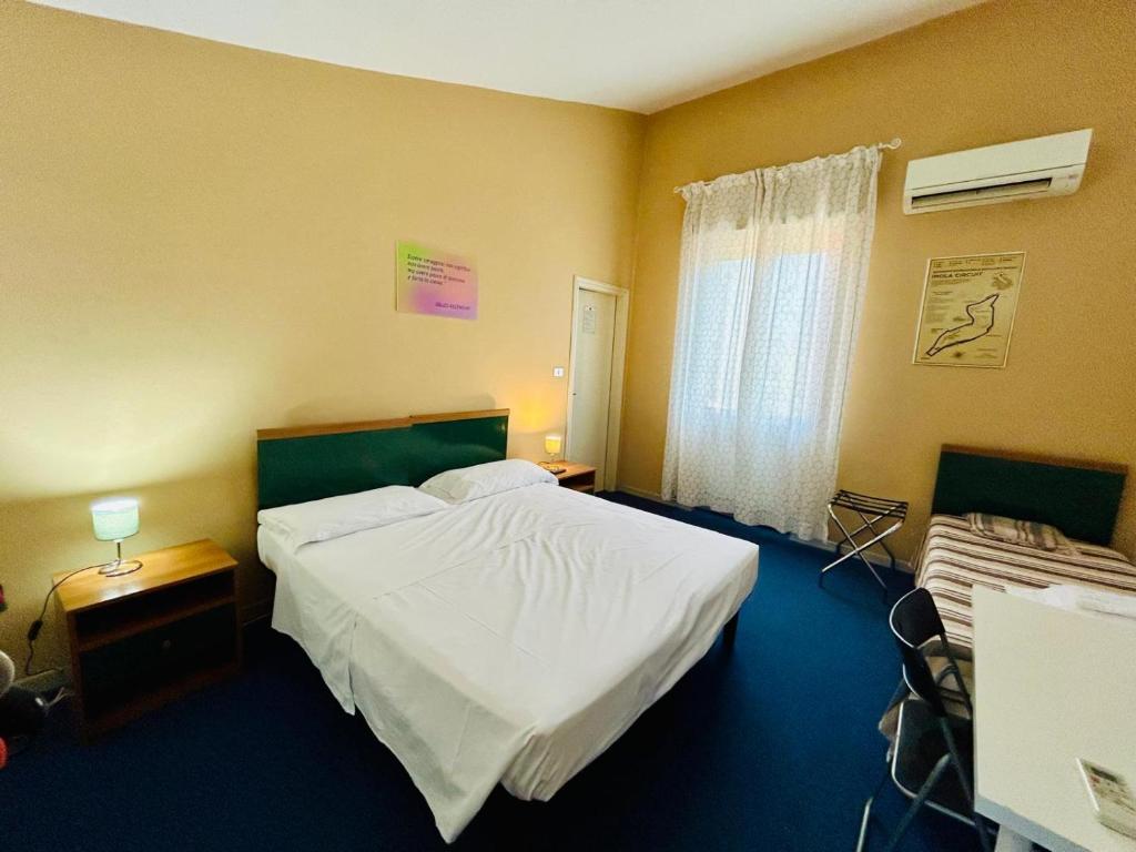 Postel nebo postele na pokoji v ubytování Smart Hotel Autodromo