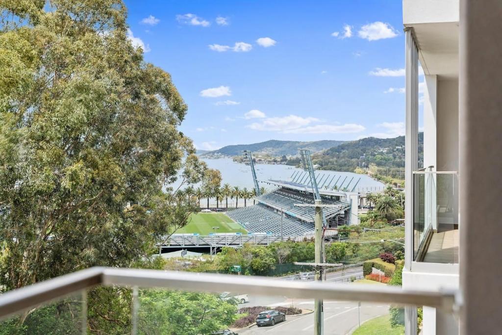 a balcony with a view of a baseball stadium at Gosford Panorama Stadium & Water Views in Gosford