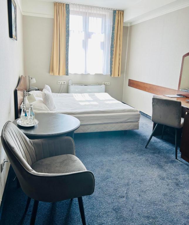 Posteľ alebo postele v izbe v ubytovaní Hotel Ambasadorski Rzeszów