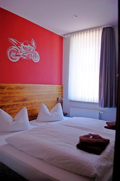 Postel nebo postele na pokoji v ubytování Dein Hotel