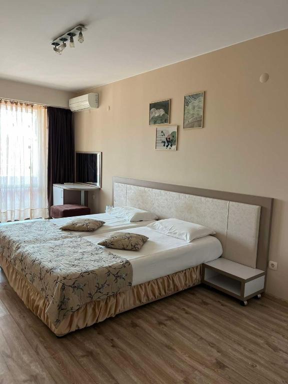 Room Iva tesisinde bir odada yatak veya yataklar