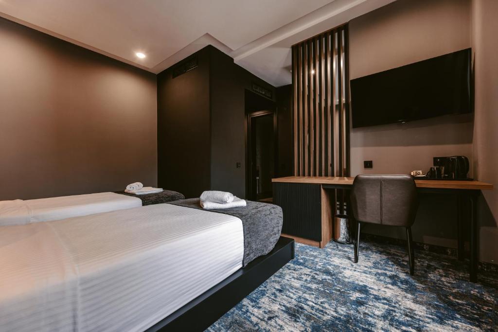 Postel nebo postele na pokoji v ubytování Hotel Splendid Tbilisi
