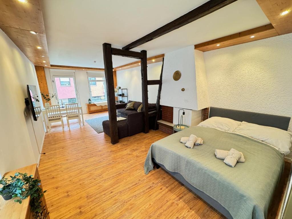 a bedroom with a bed with two stuffed animals on it at Loreley - Traumferien am Rhein in Sankt Goar