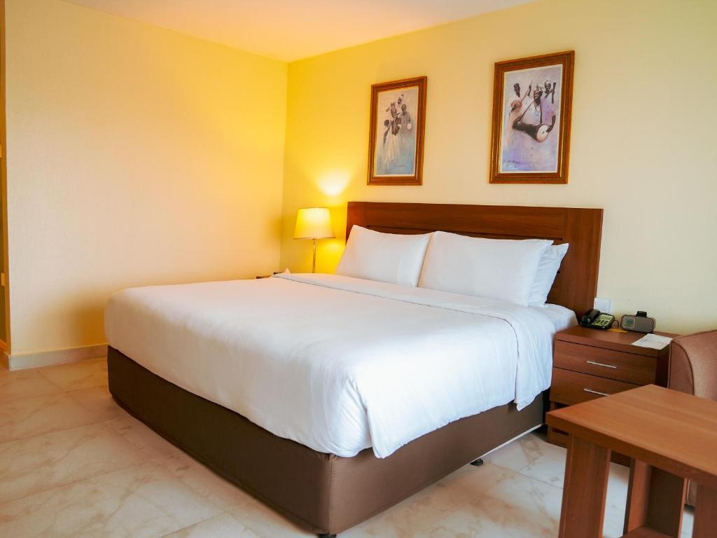 Postel nebo postele na pokoji v ubytování Abuja Continental Hotel