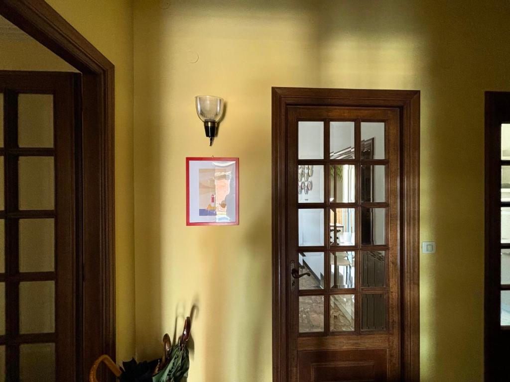 a room with two doors and a picture on the wall at Casa Cele centro città vista mare in Ventimiglia