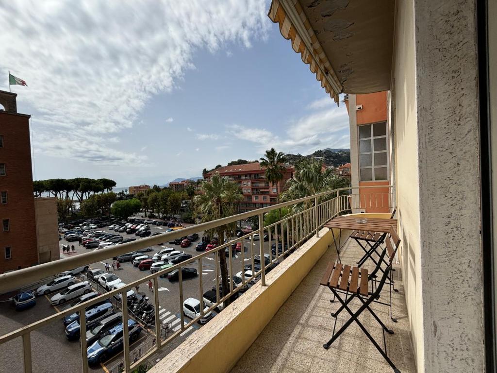 a balcony with a view of a parking lot at Casa Cele centro città vista mare in Ventimiglia