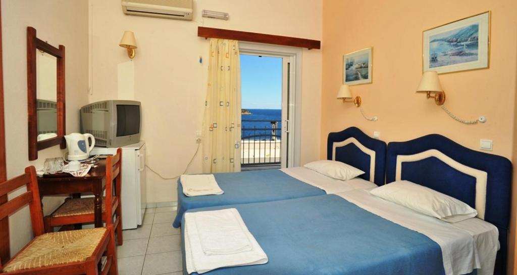 Postel nebo postele na pokoji v ubytování Pergola Hotel