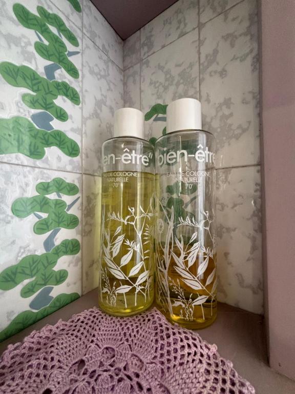two bottles of olive oil sitting on a table at Casa Cele centro città vista mare in Ventimiglia