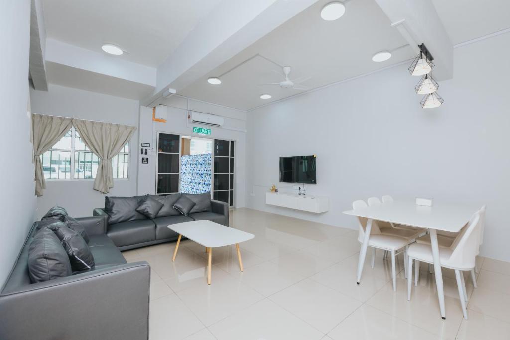 a living room with a couch and a table at kings Pine Residences Homestay kundasang Ranau 17 in Ranau