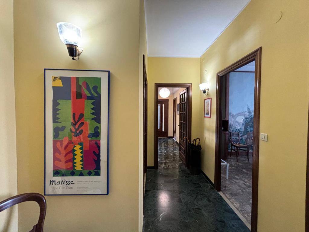 a hallway of a house with a painting on the wall at Casa Cele centro città vista mare in Ventimiglia