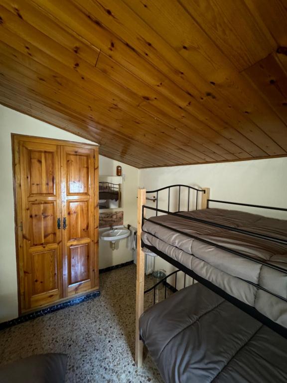 Postel nebo postele na pokoji v ubytování L Esquella Restaurante hostal