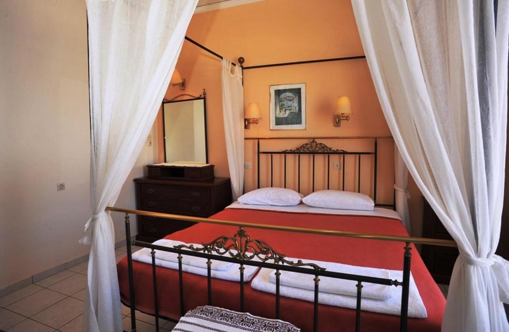 Postel nebo postele na pokoji v ubytování Pergola Hotel