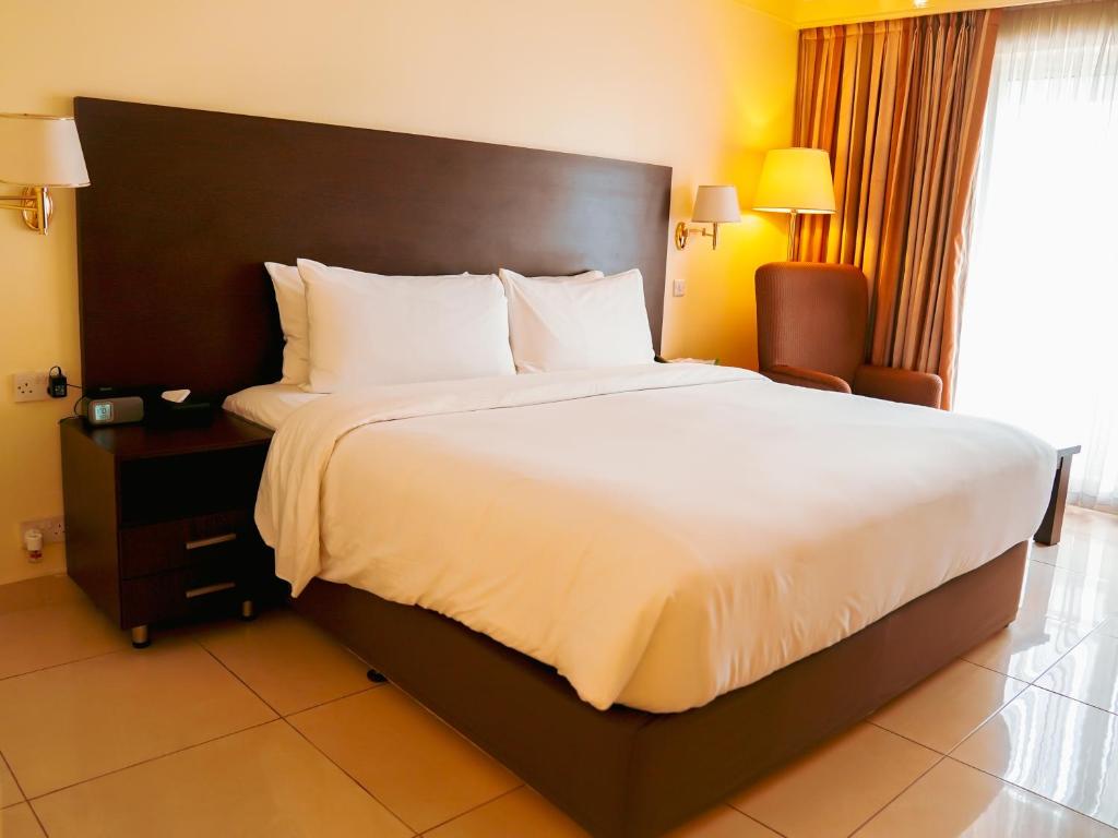 Postel nebo postele na pokoji v ubytování Abuja Continental Hotel