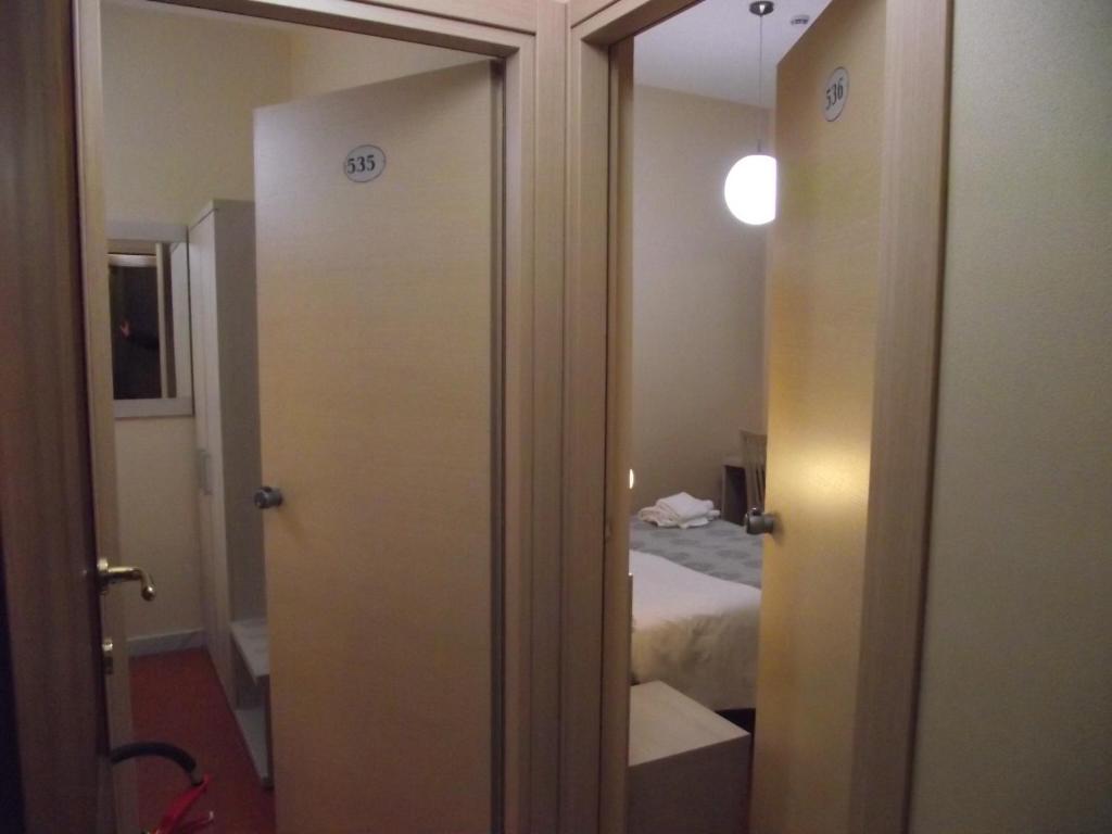 Postel nebo postele na pokoji v ubytování Hotel Elide