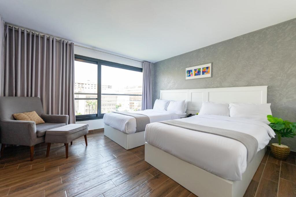 Postel nebo postele na pokoji v ubytování Nile Villa Hotel