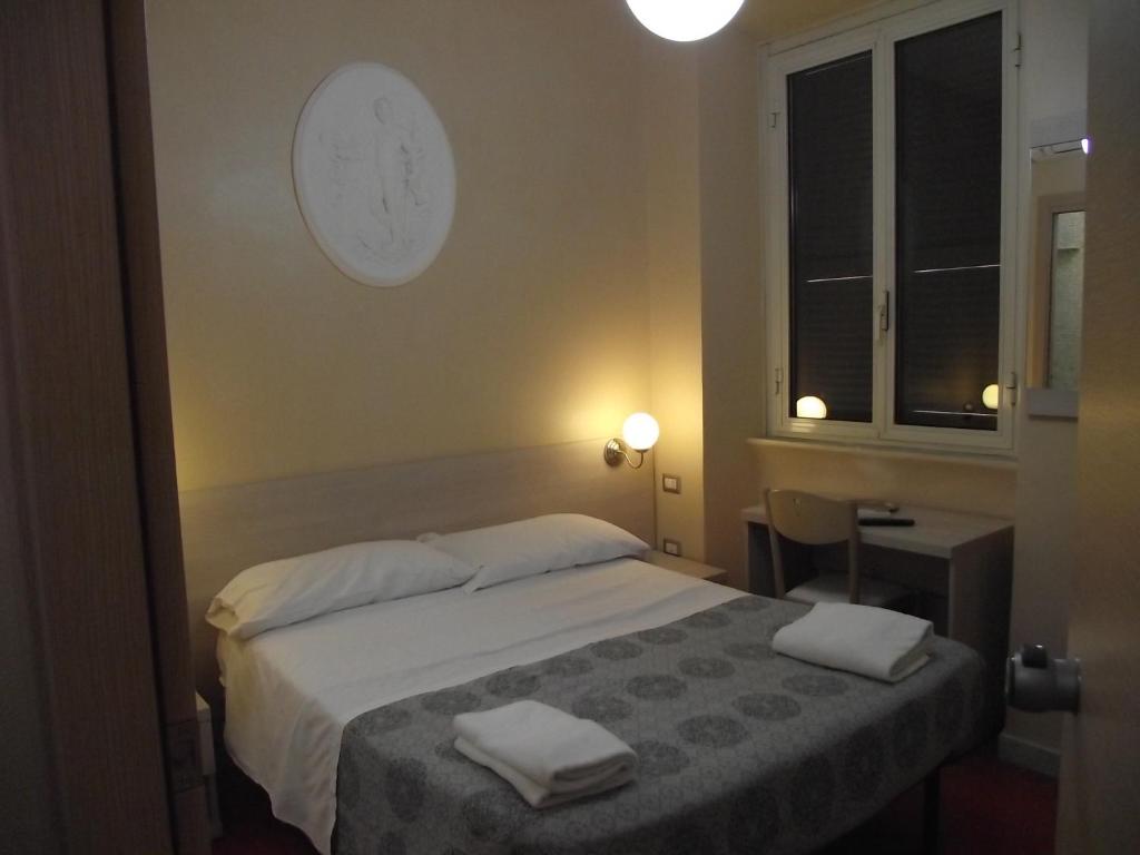 Postel nebo postele na pokoji v ubytování Hotel Elide
