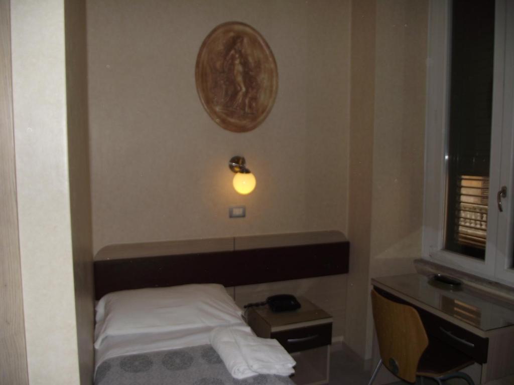 Postel nebo postele na pokoji v ubytování Hotel Elide
