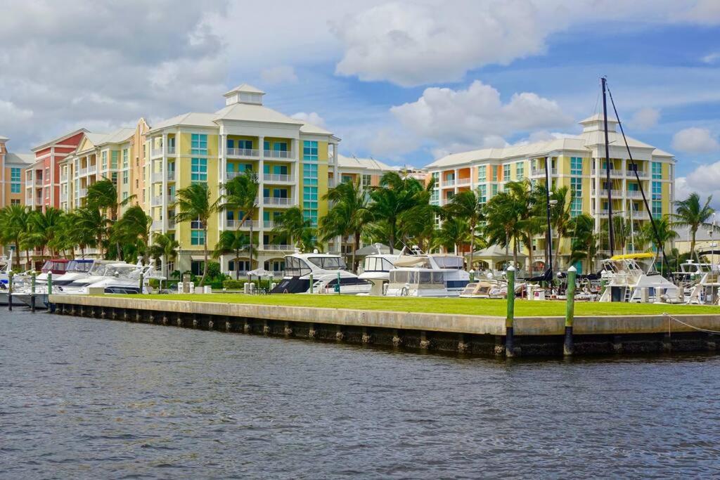 a marina with condos and boats in a harbor at Luxurious, family-friendly 3BR condo on the water in Lantana