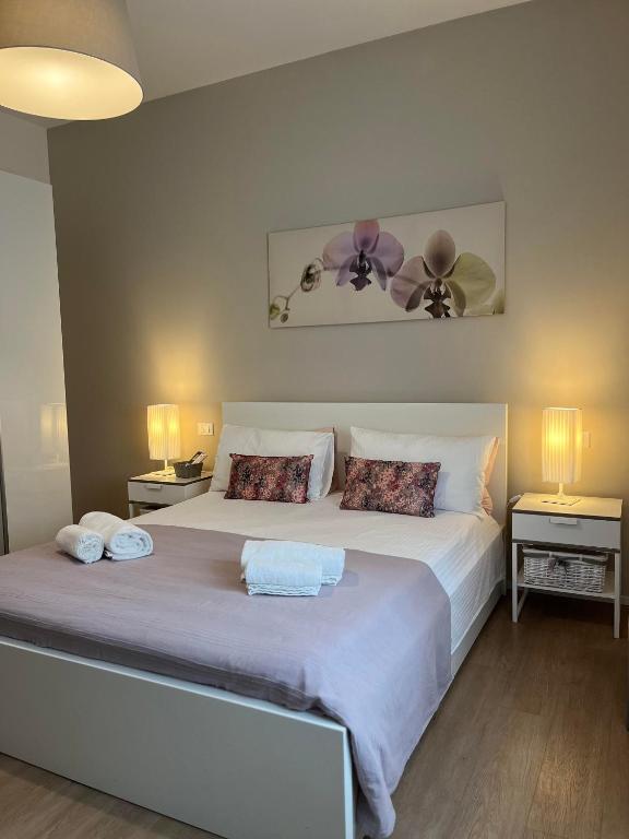 Postel nebo postele na pokoji v ubytování Villa Due Giardini