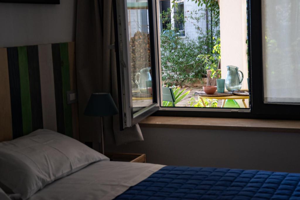 Letto o letti in una camera di B&B Buongiorno Caprarola