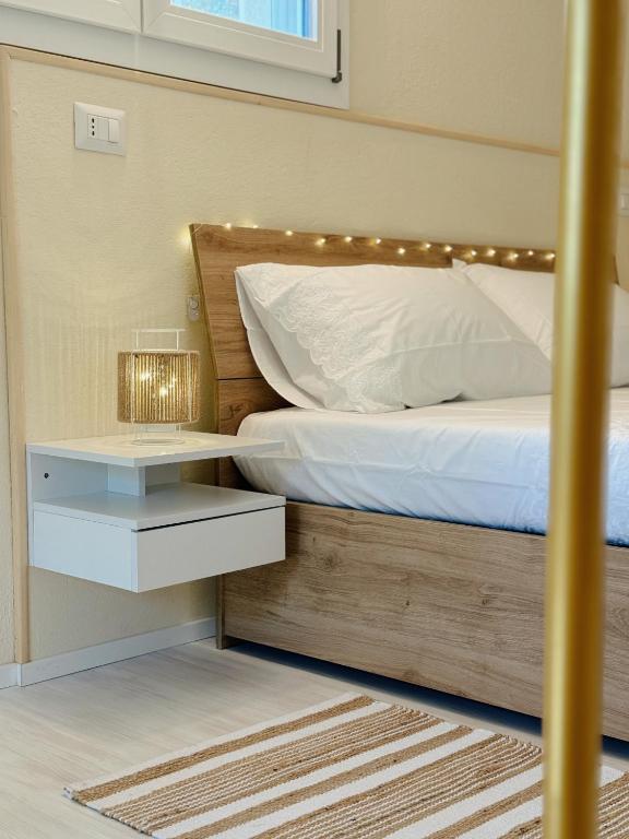 a bedroom with a bed with lights on it at Casa di campagna 'Sa Vinzedda' in Galtellì