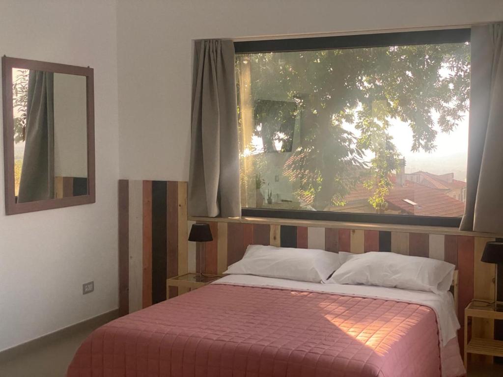 Letto o letti in una camera di B&B Buongiorno Caprarola