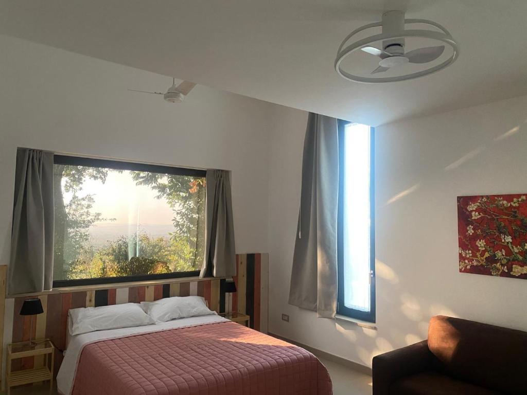 Letto o letti in una camera di B&B Buongiorno Caprarola