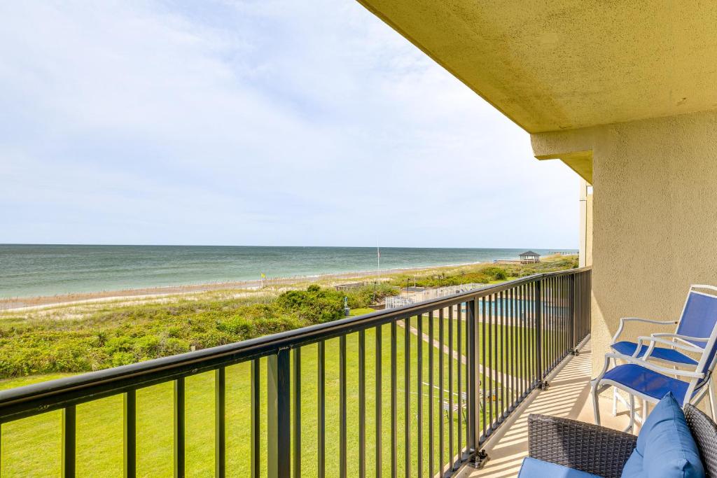a balcony with chairs and a view of the ocean at Oceanfront Atlantic Beach Condo with View! in Atlantic Beach