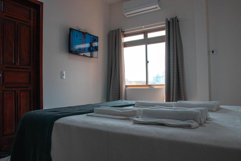 Postel nebo postele na pokoji v ubytování Hotel 15 de Julho