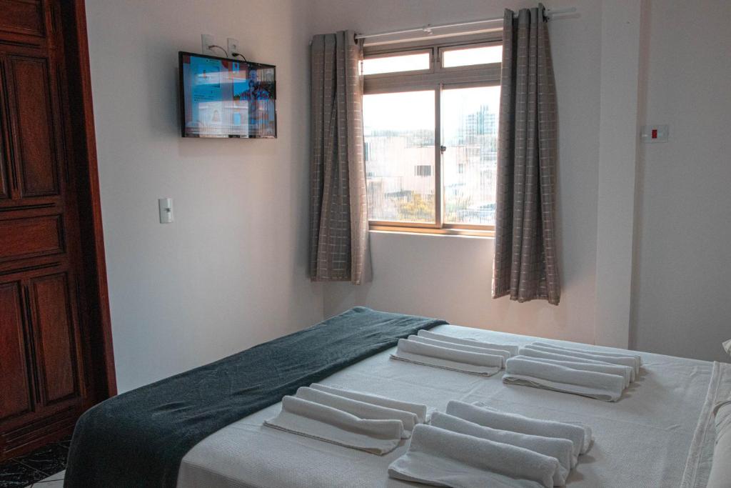 Postel nebo postele na pokoji v ubytování Hotel 15 de Julho