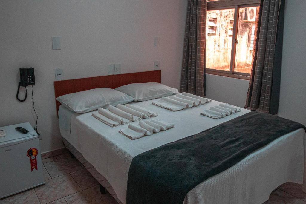 Postel nebo postele na pokoji v ubytování Hotel 15 de Julho