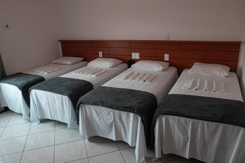 Postel nebo postele na pokoji v ubytování Hotel 15 de Julho