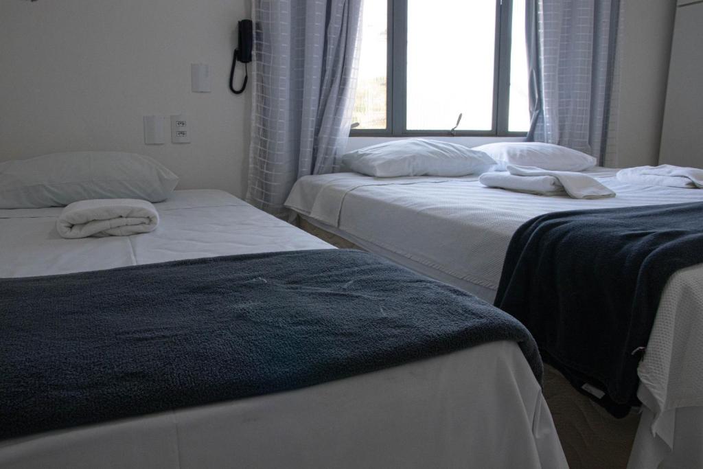 Postel nebo postele na pokoji v ubytování Hotel 15 de Julho