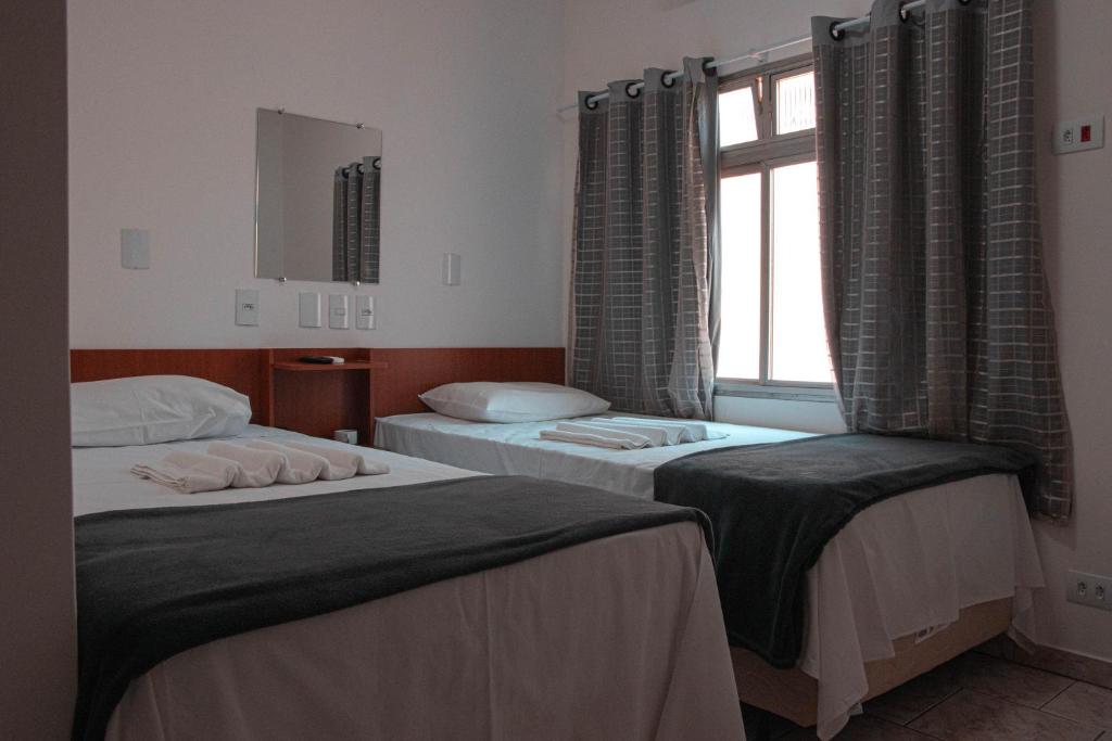 Postel nebo postele na pokoji v ubytování Hotel 15 de Julho