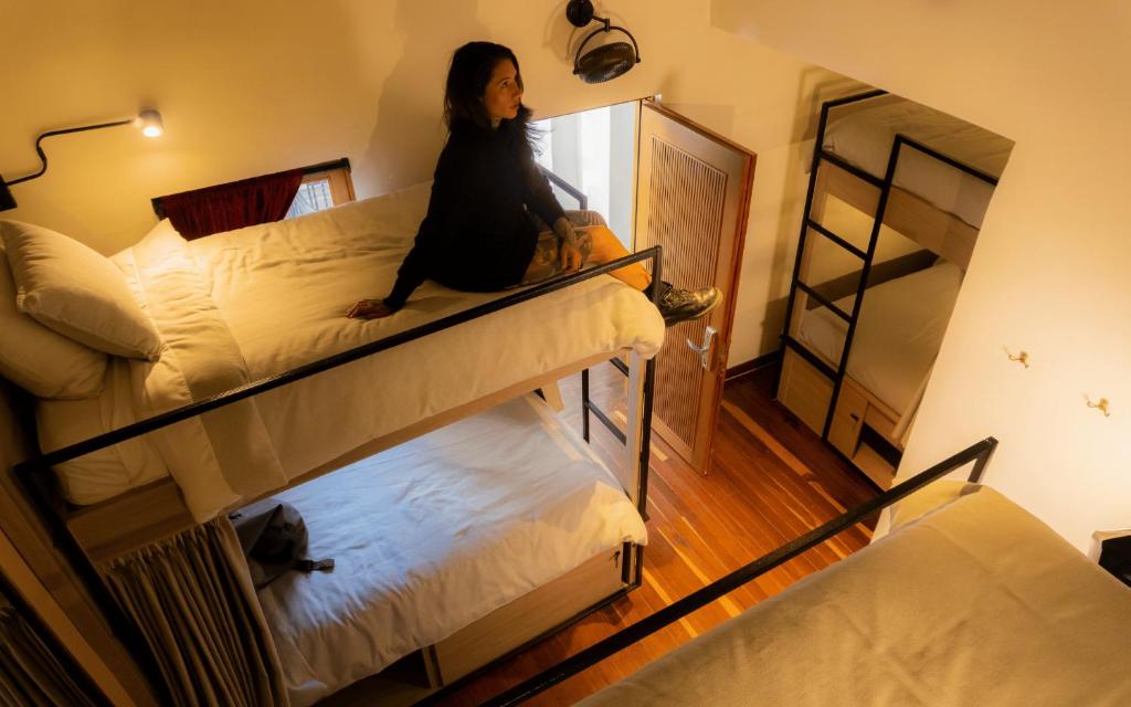 Postel nebo postele na pokoji v ubytování Casa Dreamer Bogotá