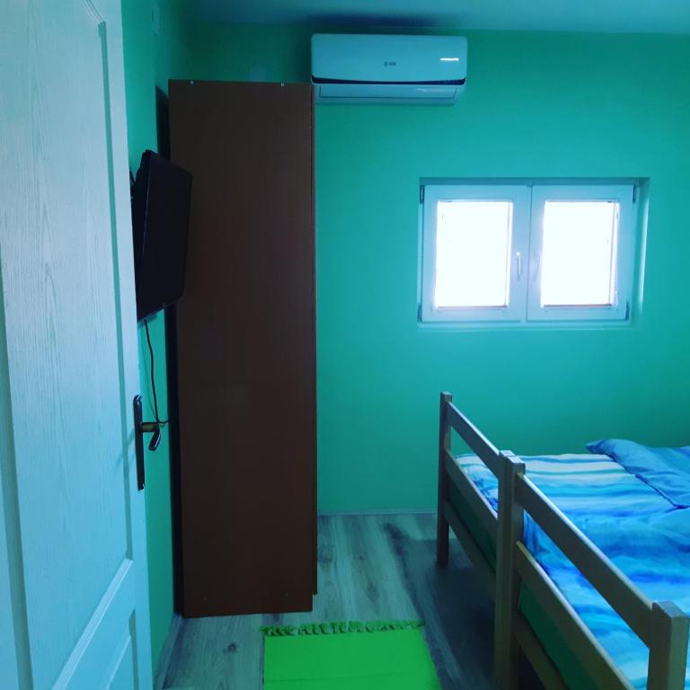 Postel nebo postele na pokoji v ubytování VILANATALIJA PANSION, APATIN