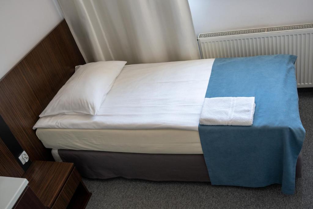 Postel nebo postele na pokoji v ubytování Aparthotel Strefa Premium