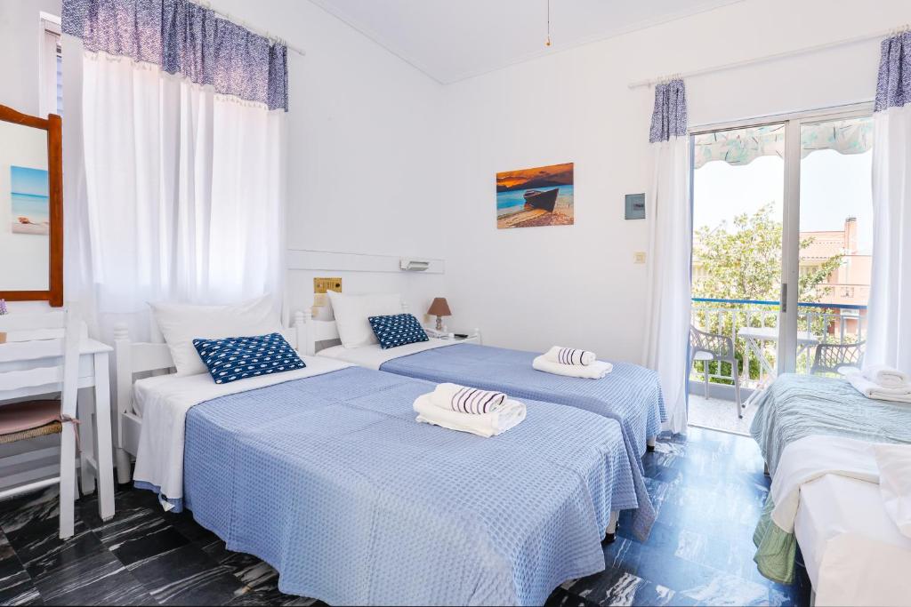 Postel nebo postele na pokoji v ubytování Melissani hotel