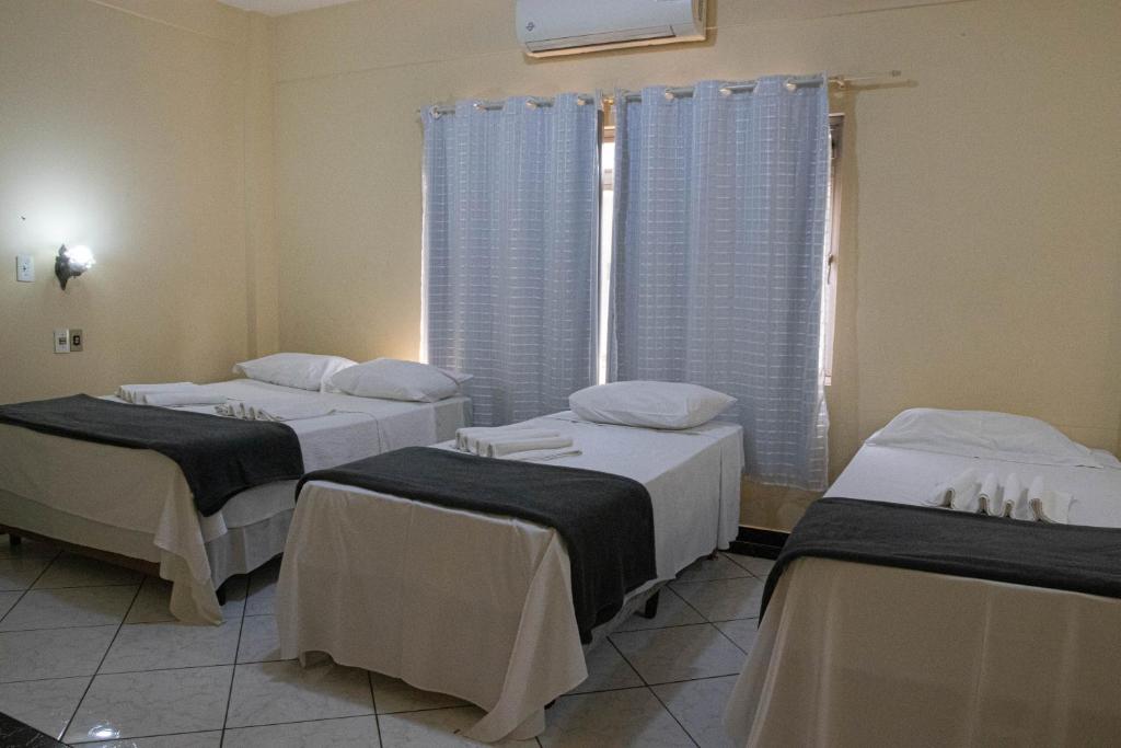 Postel nebo postele na pokoji v ubytování Hotel 15 de Julho