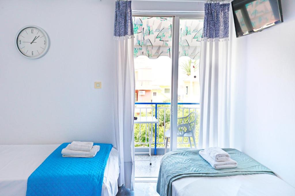 Postel nebo postele na pokoji v ubytování Melissani hotel