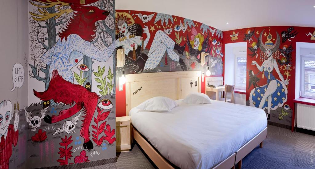Postel nebo postele na pokoji v ubytování Hôtel Graffalgar