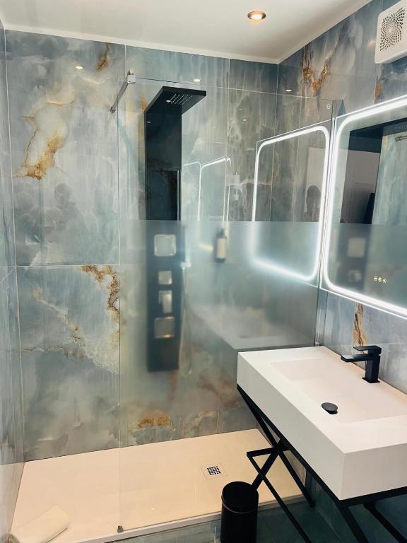 a bathroom with a sink and a shower at Santa Margherita Firenze in Florence