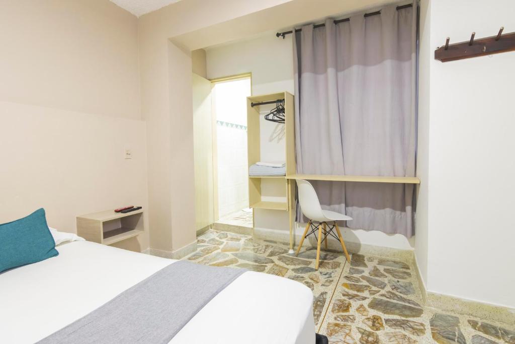 Postel nebo postele na pokoji v ubytování Ayenda 1228 Balcones de la 70