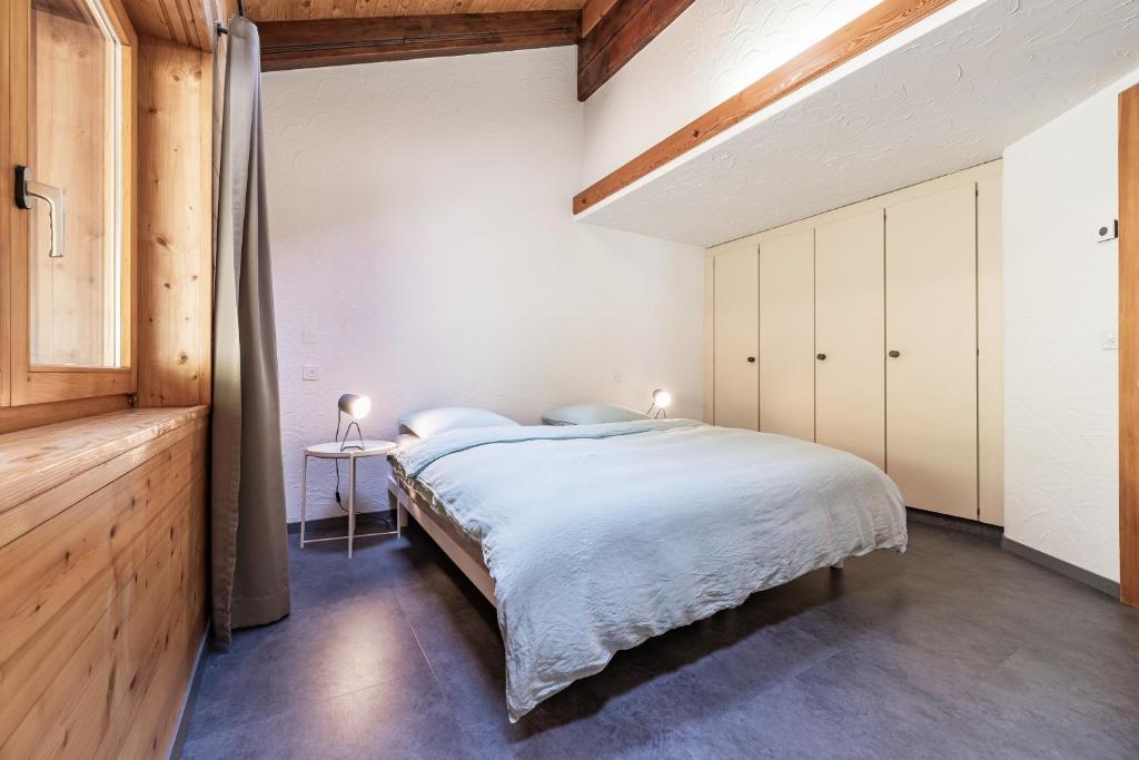 Postel nebo postele na pokoji v ubytování Mirador auf der Sonnenterrasse von Saas-Fee